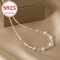 Silvery necklace with large and small pearls